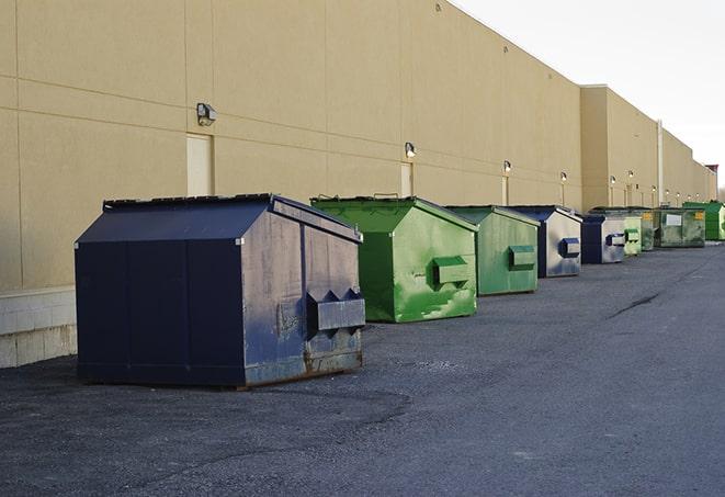 construction dumpsters on a worksite surrounded by caution tape in Lucerne, IN